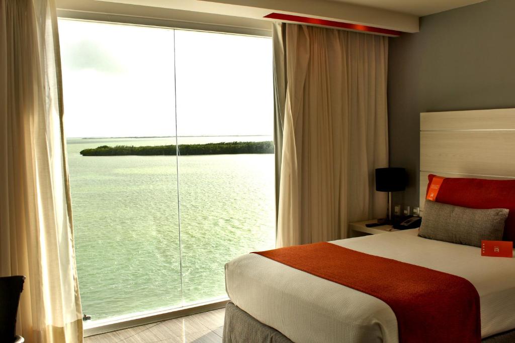 Postel nebo postele na pokoji v ubytování Real Inn Cancún