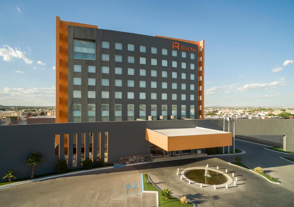 a rendering of the front of a hotel at Real Inn Ciudad Juarez by the USA Consulate in Ciudad Juárez