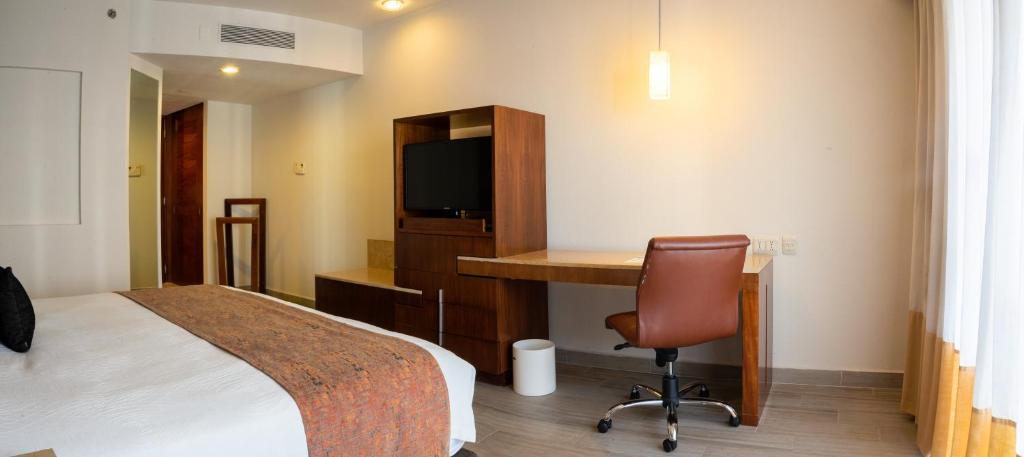 Postel nebo postele na pokoji v ubytování Real Inn Guadalajara Expo