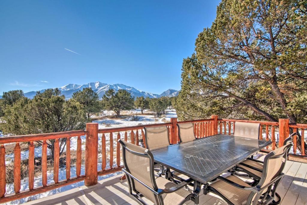 a table and chairs on a deck with a view at Buena Vista Oasis with Mtn Views, 3 Mi to Dtwn! in Buena Vista