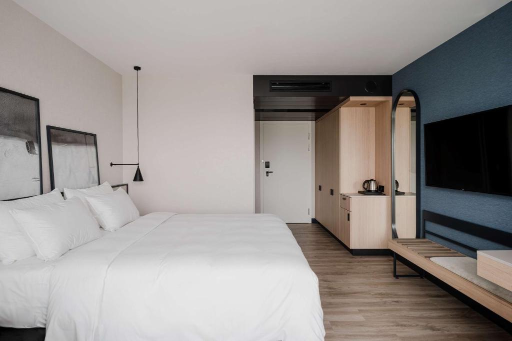 Postel nebo postele na pokoji v ubytování Radisson Resort Kołobrzeg