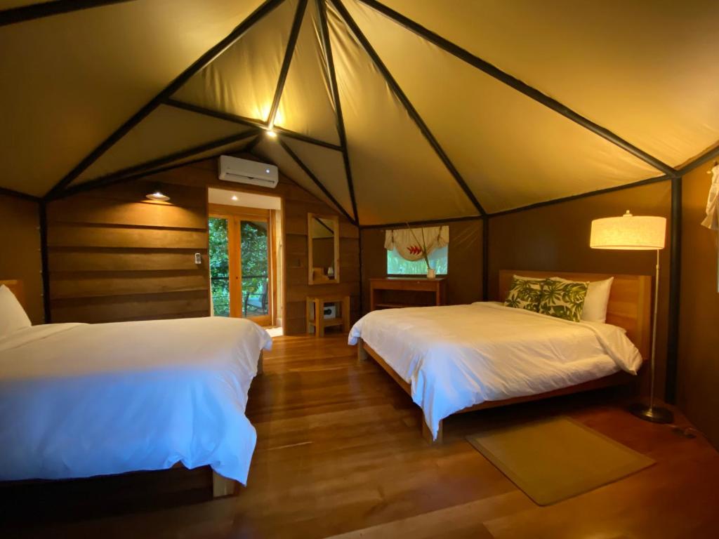 Postel nebo postele na pokoji v ubytování Hotel Arenal Glamping