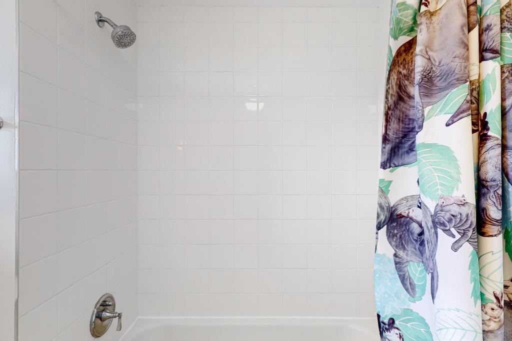 a shower curtain with elephants on it in a bathroom at Lazy C Ranch in Tucson
