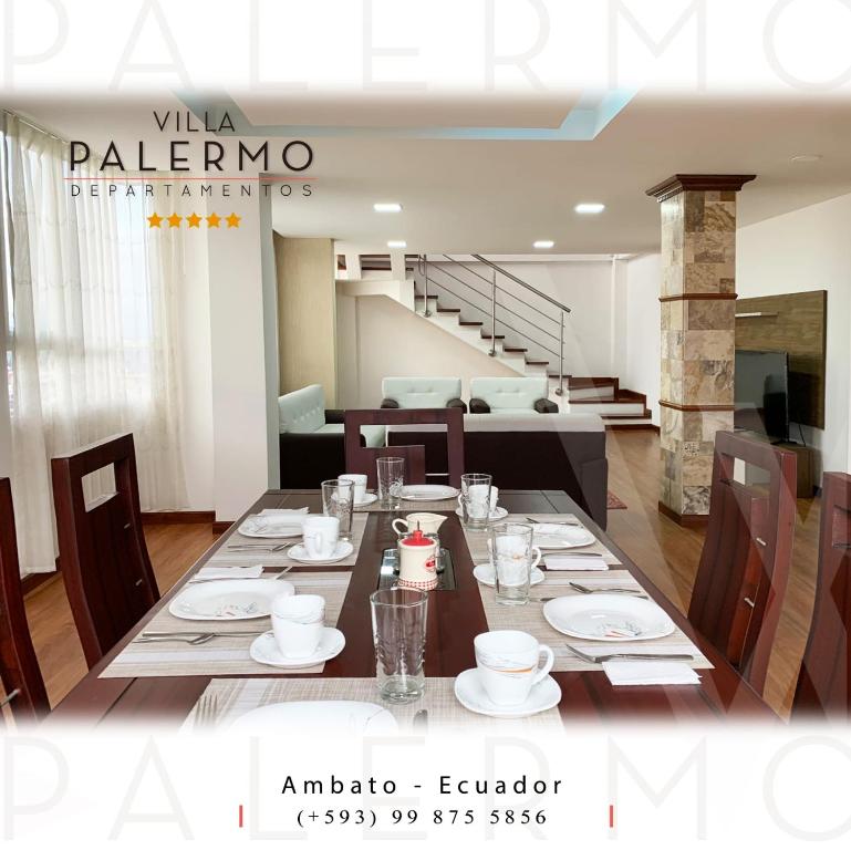 un comedor con una mesa con platos y tazas en Instant Hotel - Villa Palermo Apartments en Ambato