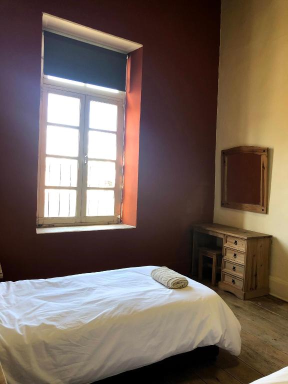 Postel nebo postele na pokoji v ubytování Le Mat Hostel