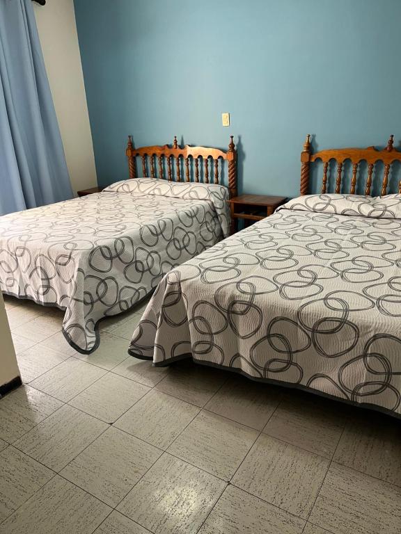 Postel nebo postele na pokoji v ubytování Hotel Paris