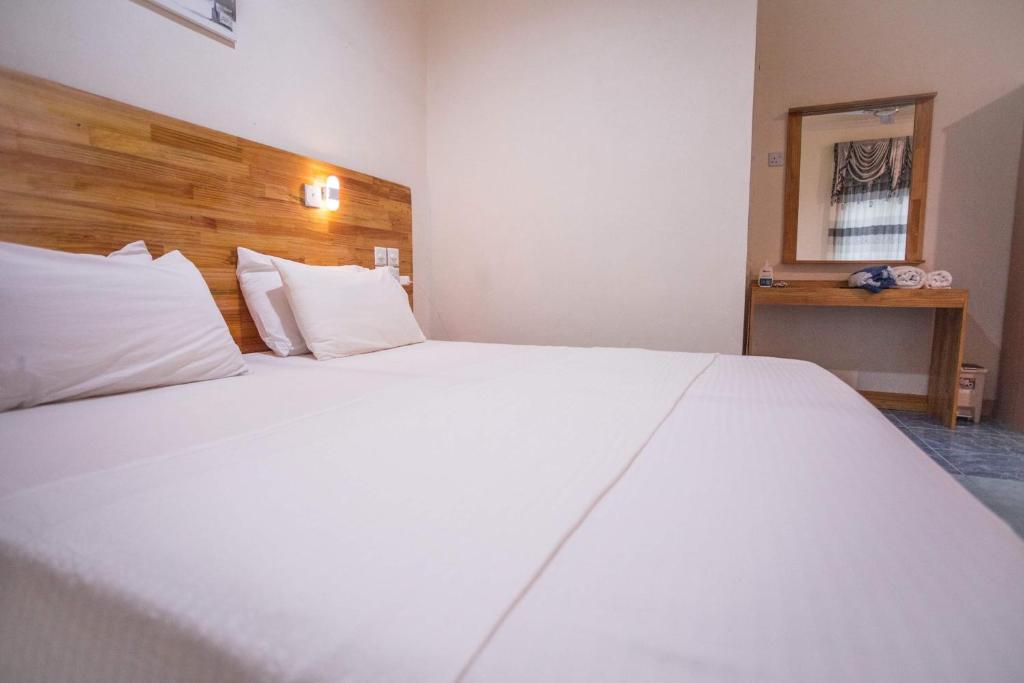 Postel nebo postele na pokoji v ubytování Veyvah Inn Maldives