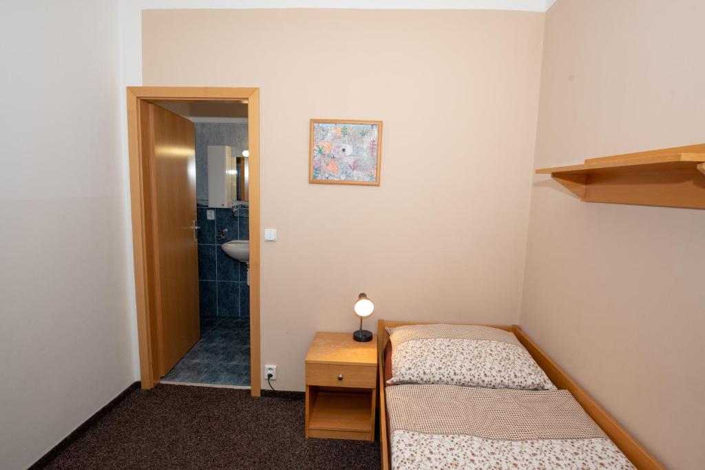 Postel nebo postele na pokoji v ubytování PENZION MAXIM