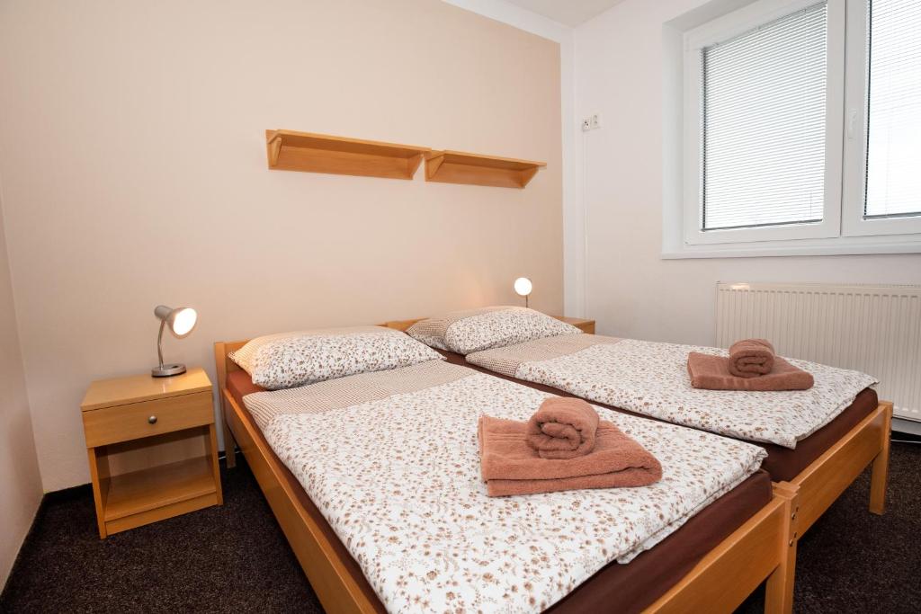 Postel nebo postele na pokoji v ubytování PENZION MAXIM
