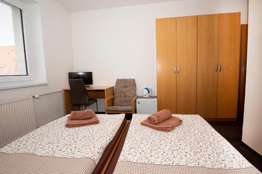 Postel nebo postele na pokoji v ubytování PENZION MAXIM