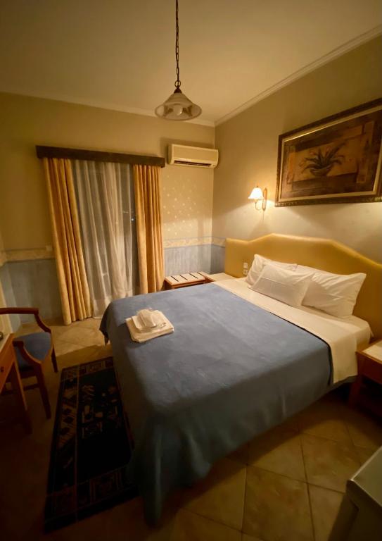 Postel nebo postele na pokoji v ubytování Arma Faliro Apartments