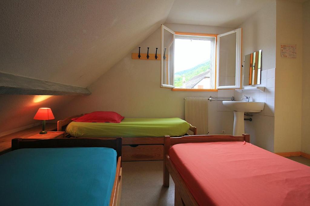 Postel nebo postele na pokoji v ubytování Maison Despourrins