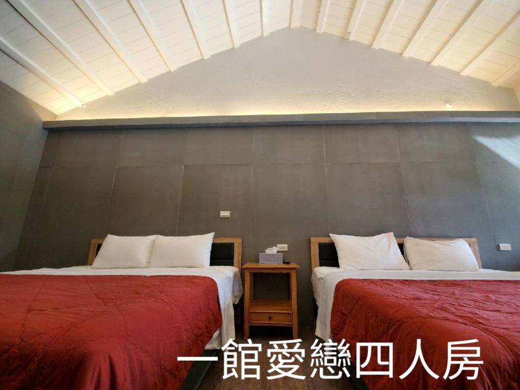 Postel nebo postele na pokoji v ubytování 墾丁牧場Villa Kenting Pasture - Villa B&B