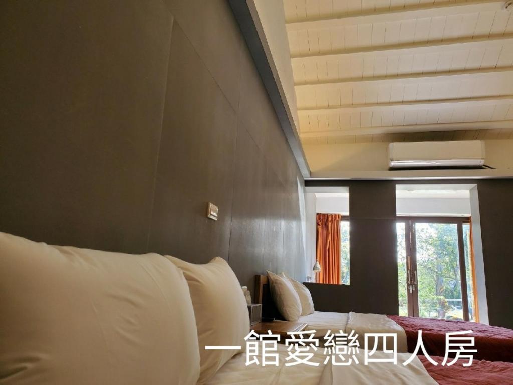 Postel nebo postele na pokoji v ubytování 墾丁牧場Villa Kenting Pasture - Villa B&B