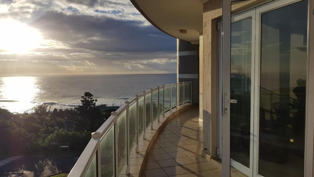 a balcony of a building with a view of the ocean at 10 Seahorse, Scottburgh in Scottburgh