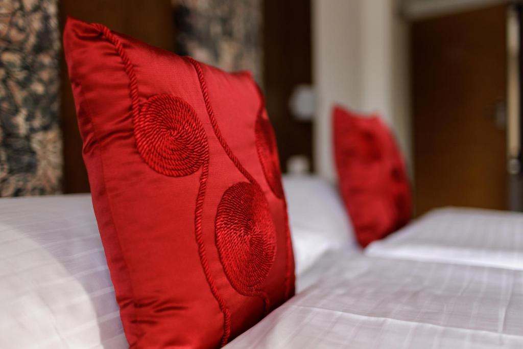 Postel nebo postele na pokoji v ubytování Hotel Garni Toscanina - Adults Only