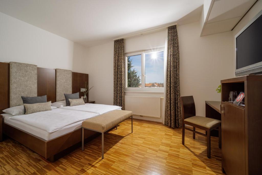 Postel nebo postele na pokoji v ubytování Hotel Garni Toscanina - Adults Only
