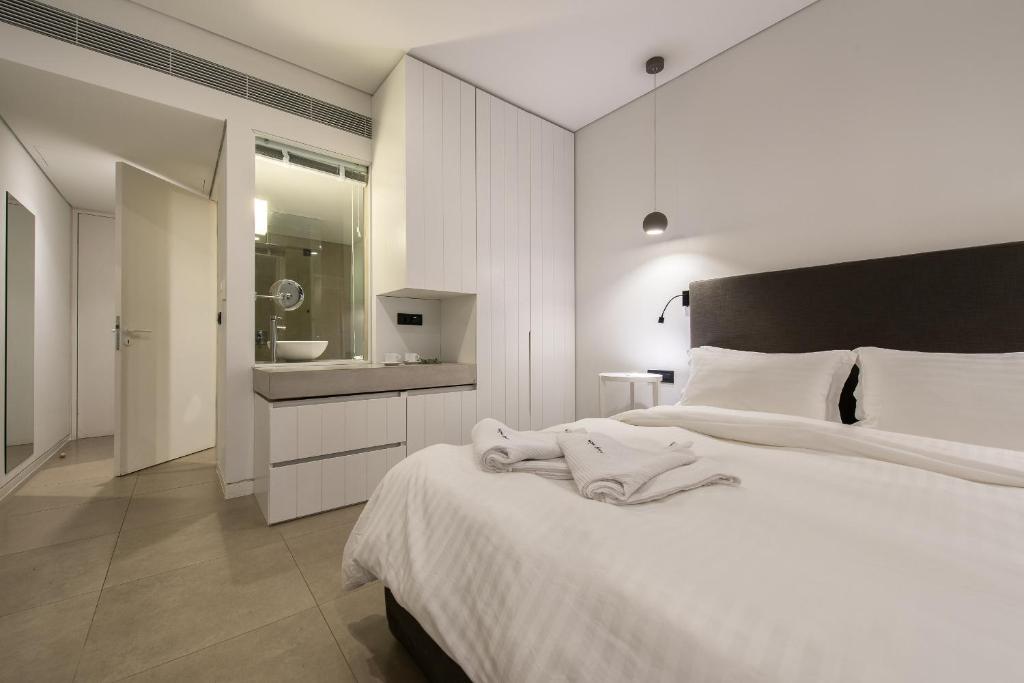 Posteľ alebo postele v izbe v ubytovaní Aqua Bay