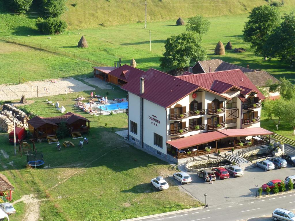 an aerial view of a hotel with a parking lot at HOTEL CARPATHIA in Remeţi