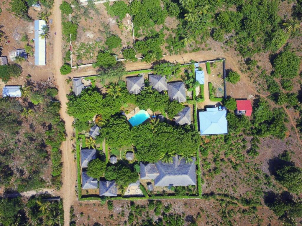 an overhead view of a park with trees and buildings at Eco Villas Watamu in Watamu