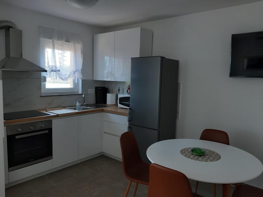 Kuchyň nebo kuchyňský kout v ubytování Gita Apartmani