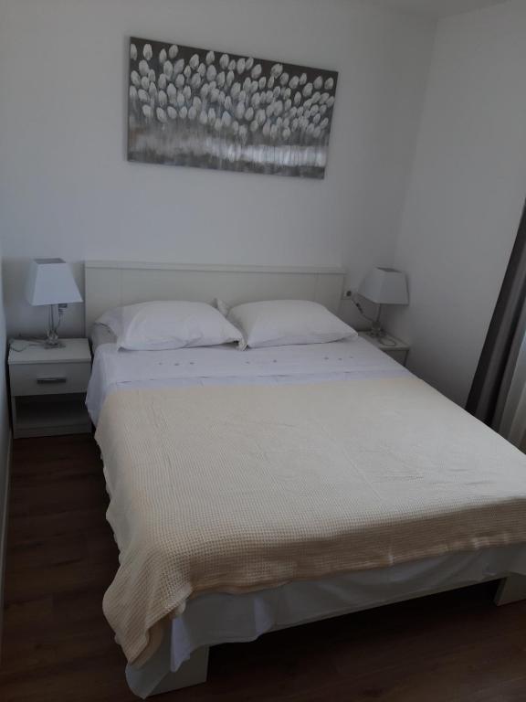 Postel nebo postele na pokoji v ubytování Gita Apartmani