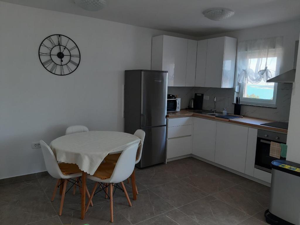 Kuchyň nebo kuchyňský kout v ubytování Gita Apartmani