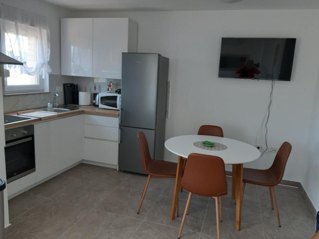Kuchyň nebo kuchyňský kout v ubytování Gita Apartmani