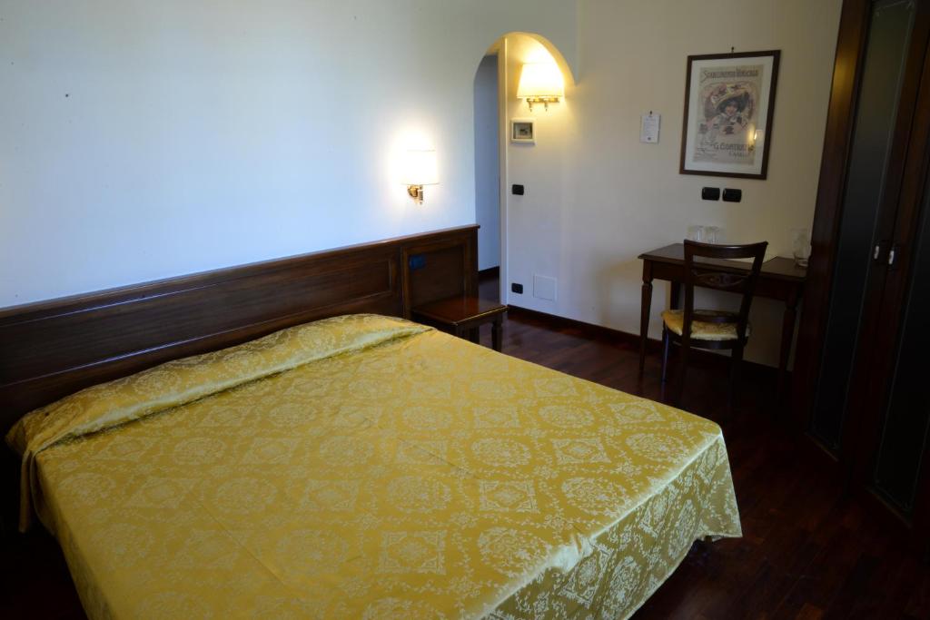 Postel nebo postele na pokoji v ubytování Villa Chiara Hotel