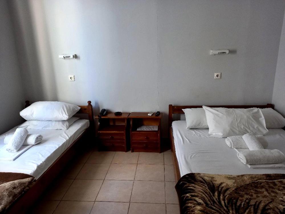 Postel nebo postele na pokoji v ubytování Hotel Korydallos
