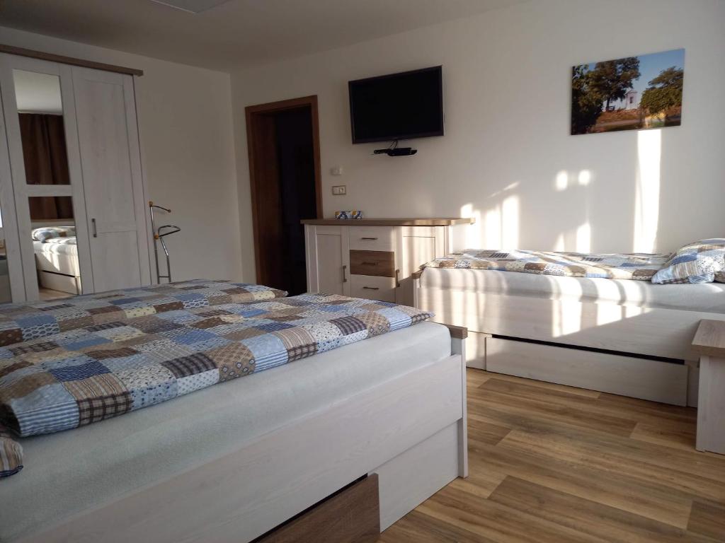Postel nebo postele na pokoji v ubytování Apartmány 27
