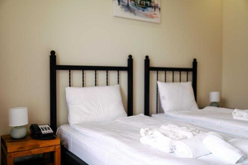 Postel nebo postele na pokoji v ubytování Mountain House Kazbegi