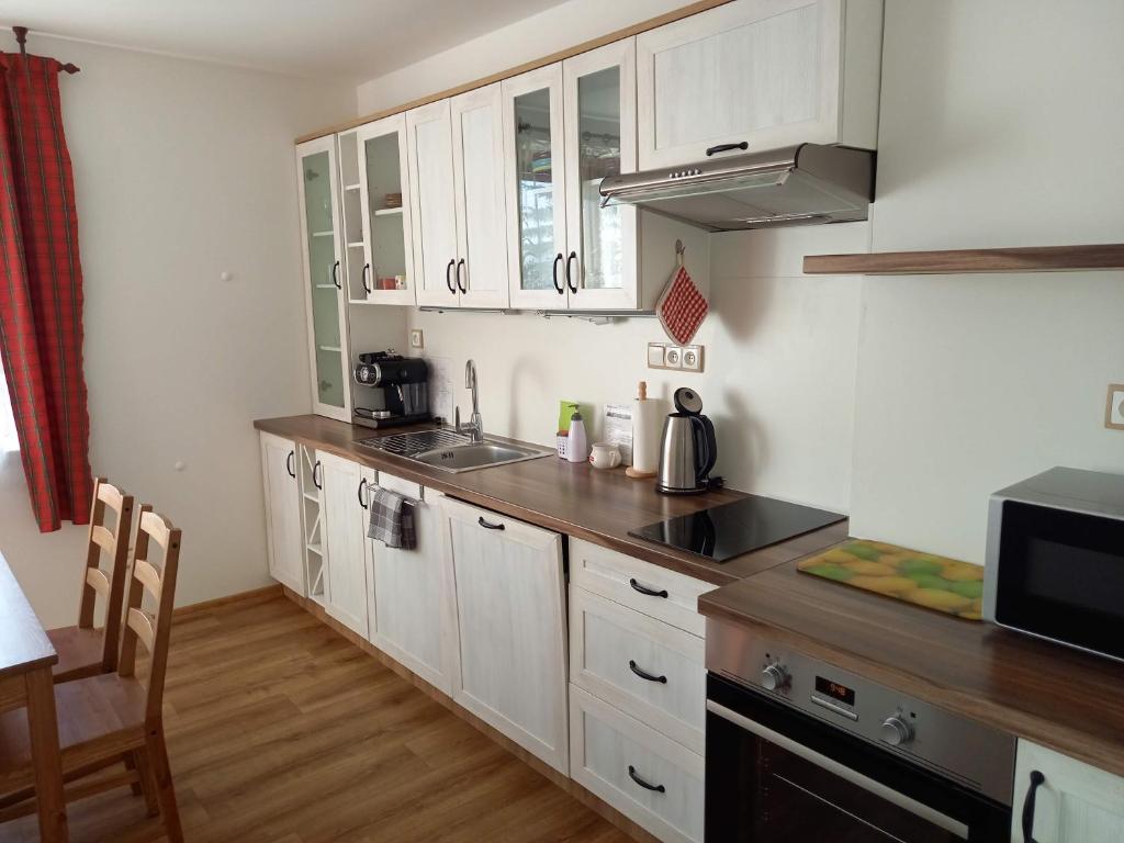 Kuchyň nebo kuchyňský kout v ubytování Apartmány 27