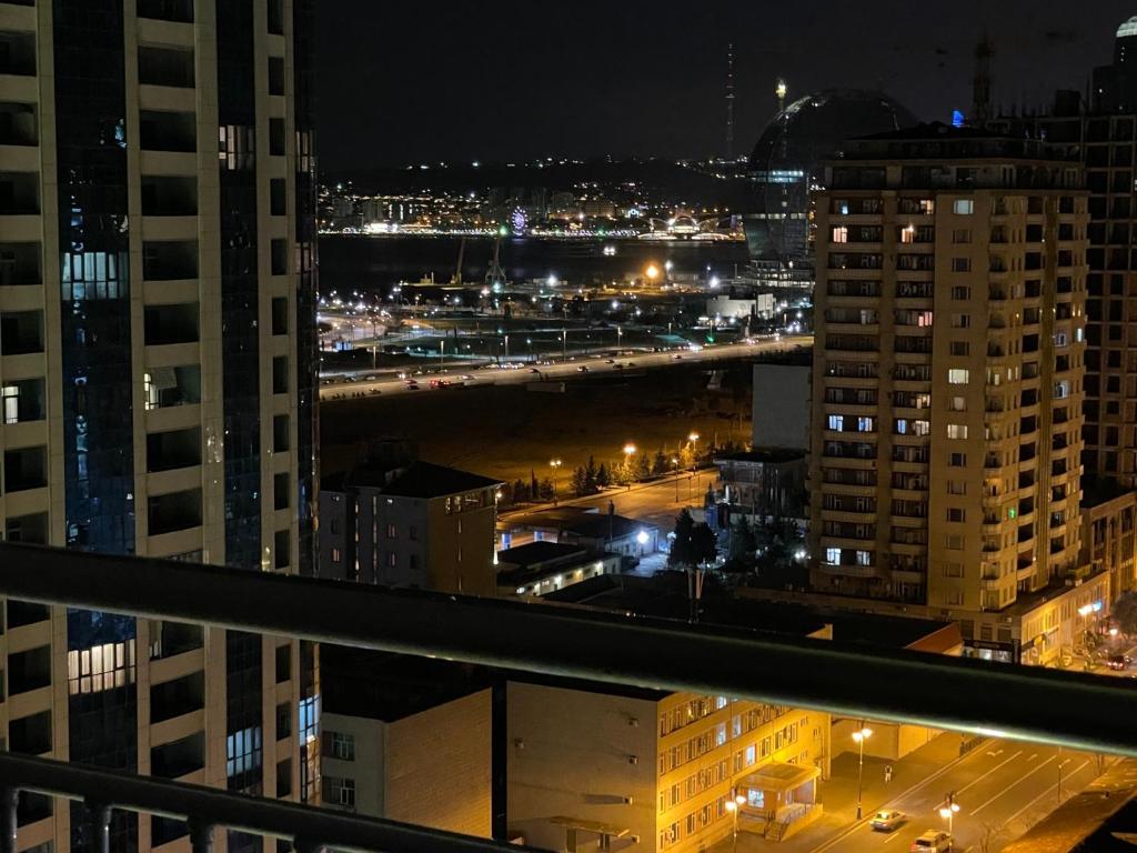 a view of a city at night with traffic at Park Azure luxury in Baku