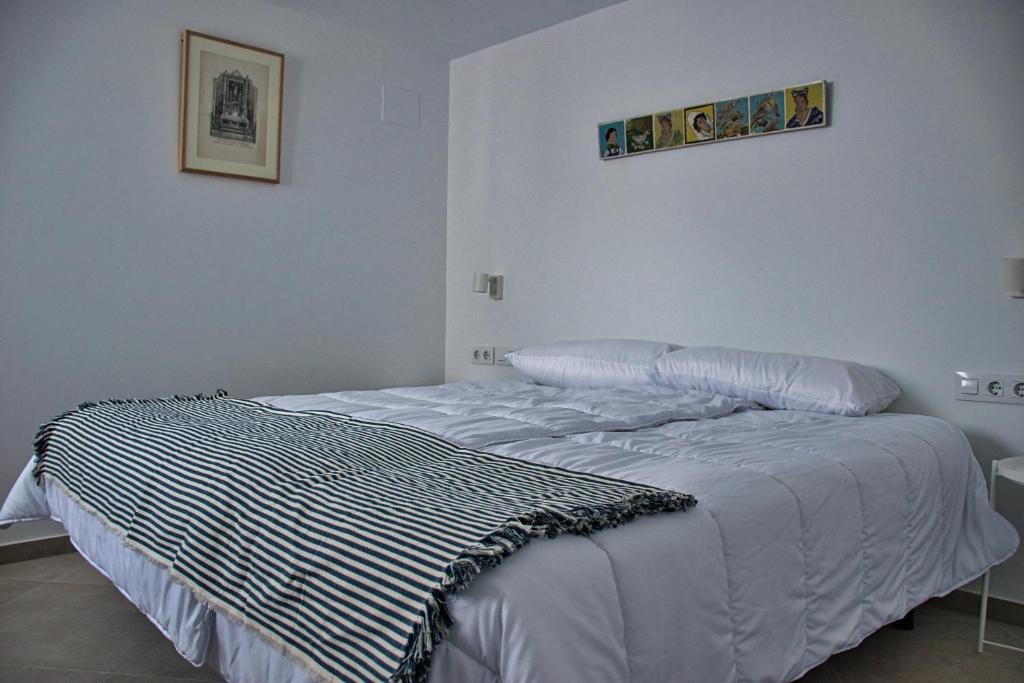 Postel nebo postele na pokoji v ubytování Covadonga 9 Apartments - Triana