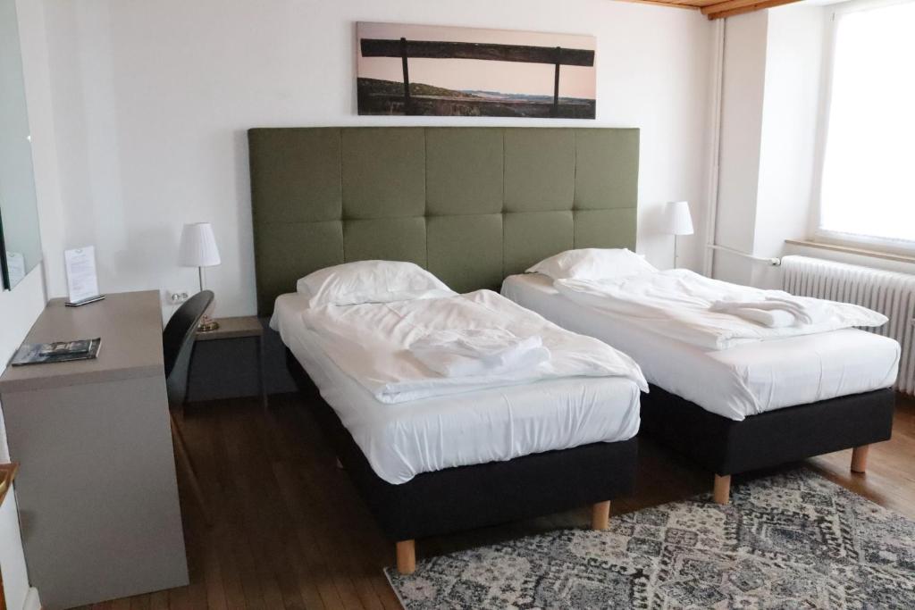 Postel nebo postele na pokoji v ubytování Hotel Huberty Kautenbach