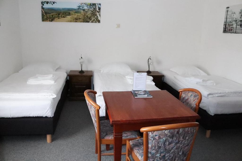 Postel nebo postele na pokoji v ubytování Hotel Huberty Kautenbach