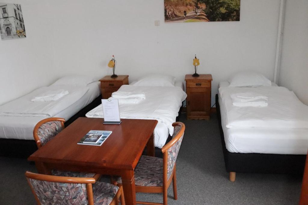 Postel nebo postele na pokoji v ubytování Hotel Huberty Kautenbach