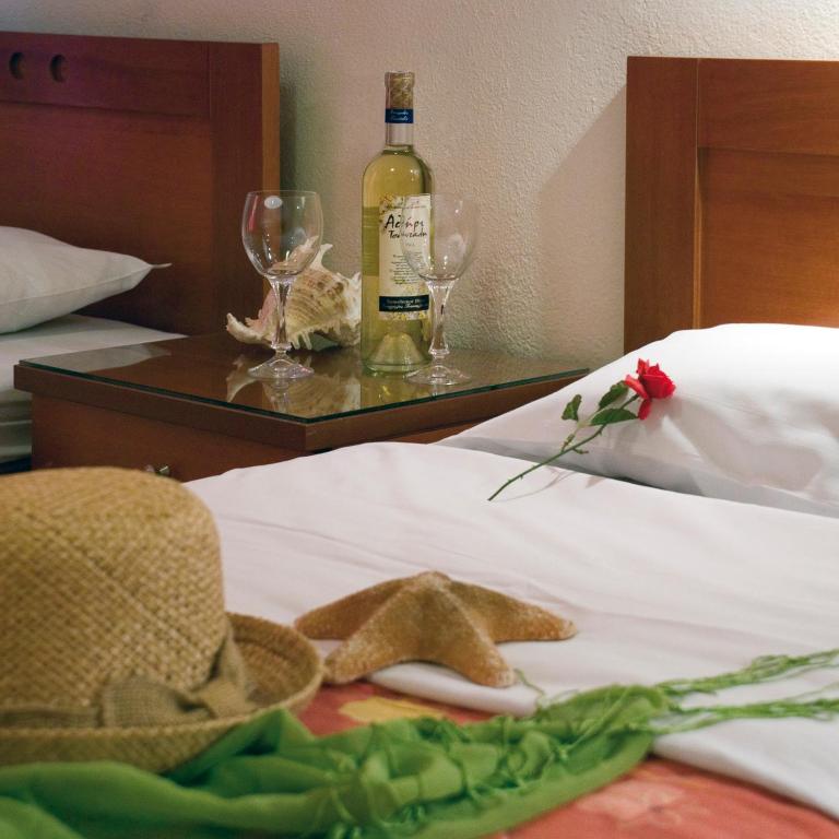 Postel nebo postele na pokoji v ubytování Hotel Rodon