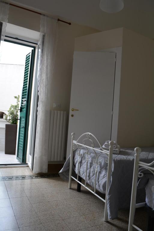 Łóżko lub łóżka w pokoju w obiekcie Casa Il Campanile