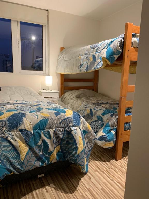 Postel nebo postele na pokoji v ubytování Tantum Concon Apartment