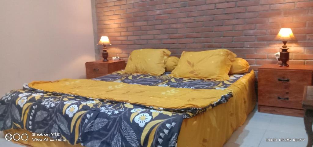 Кровать или кровати в номере Homestay Durohman