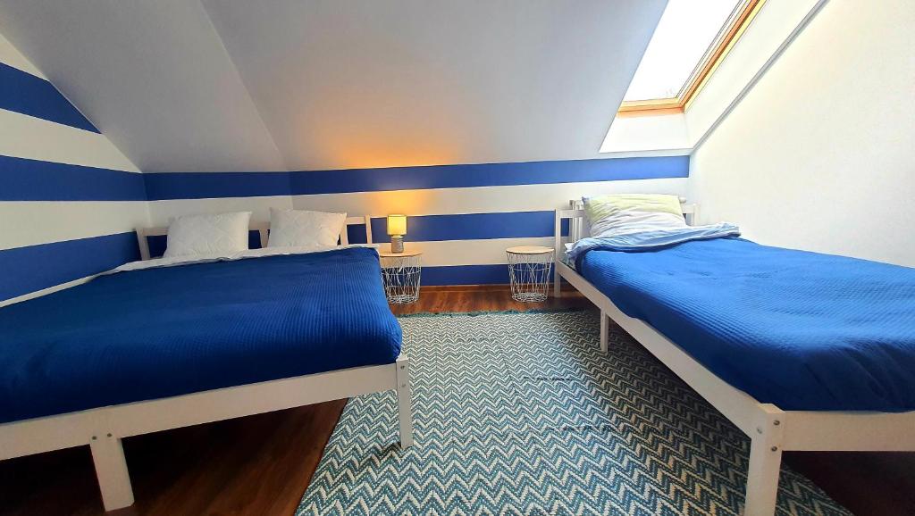 Postel nebo postele na pokoji v ubytování APARTAMENT 202