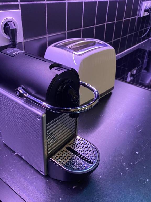 a toaster sitting on top of a kitchen counter at Bordeaux Chéri in Bordeaux