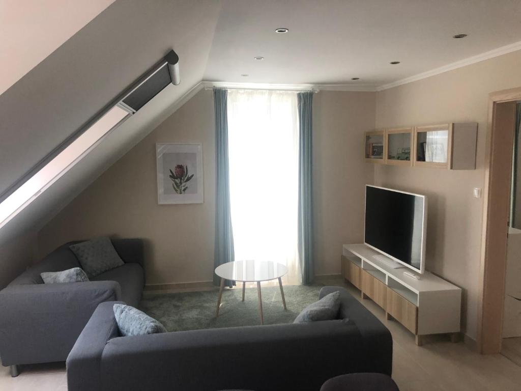 Telewizja i/lub zestaw kina domowego w obiekcie Galéria Apartmanház