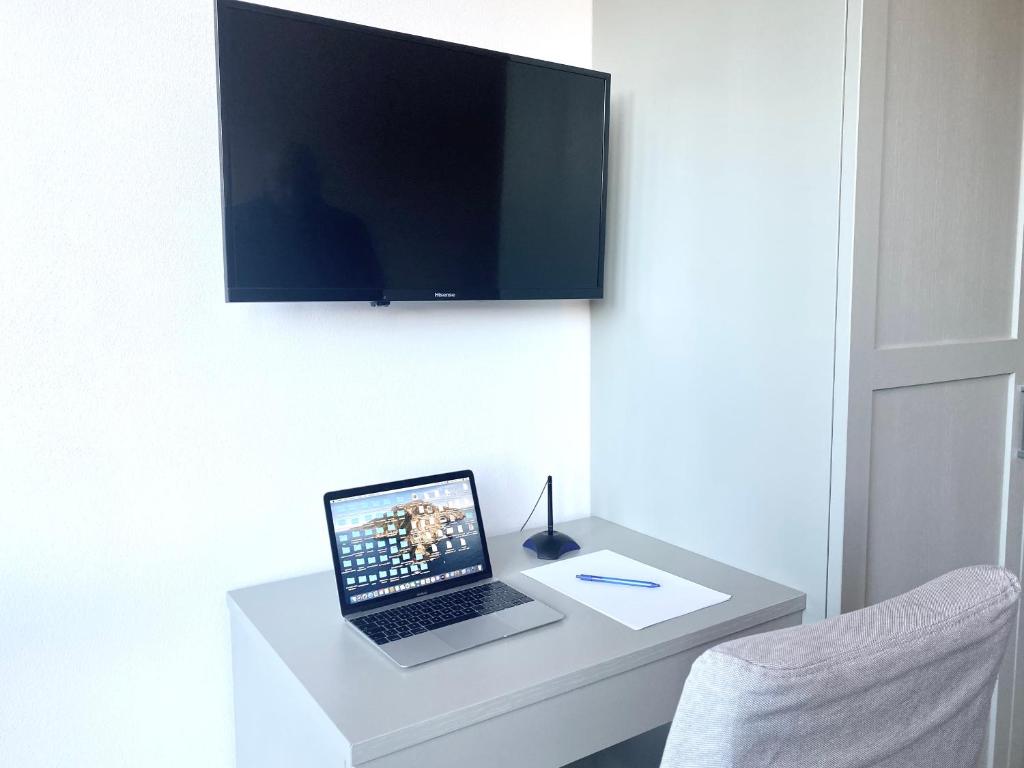 TV a/nebo společenská místnost v ubytování Vittoria Residence