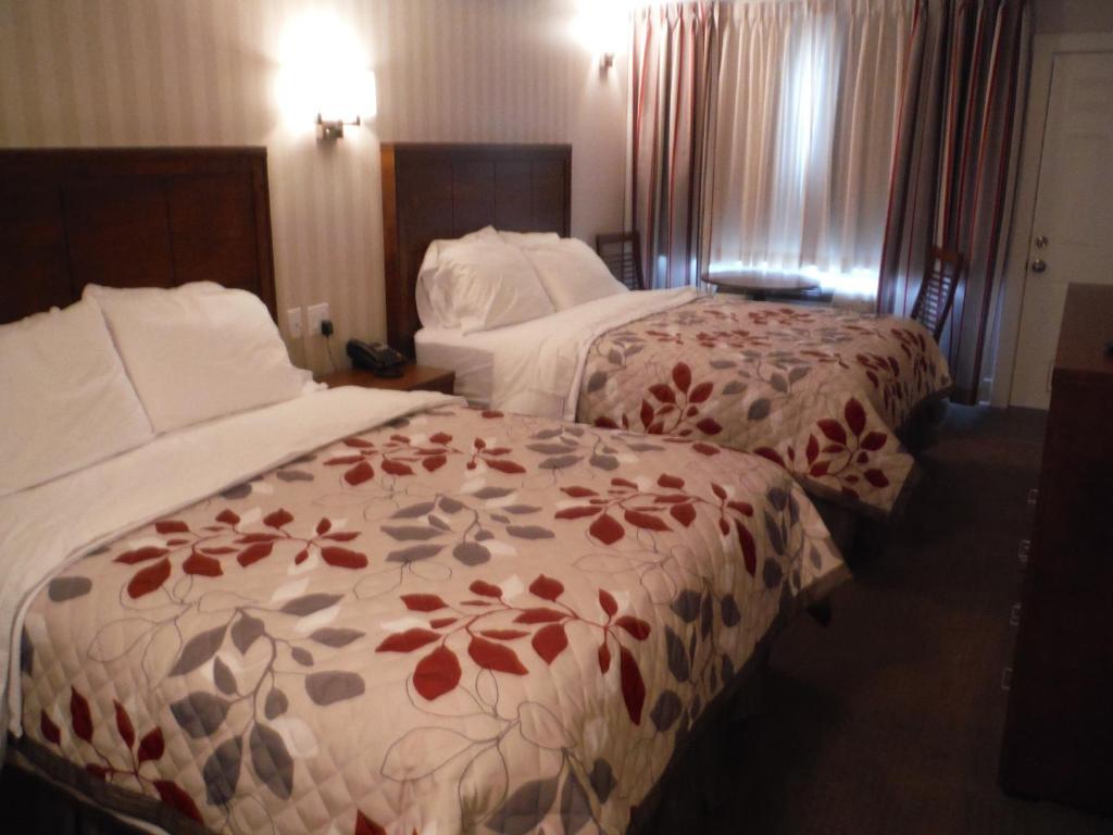 Postel nebo postele na pokoji v ubytování Motel Beausejour