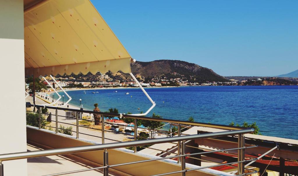 a view of the beach from the balcony of a cruise ship at Almare (Δίκλινο Δωμάτιο) in Kato Almiri