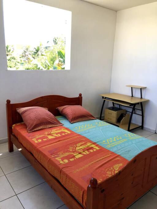 מיטה או מיטות בחדר ב-Bel appartement à Damencourt