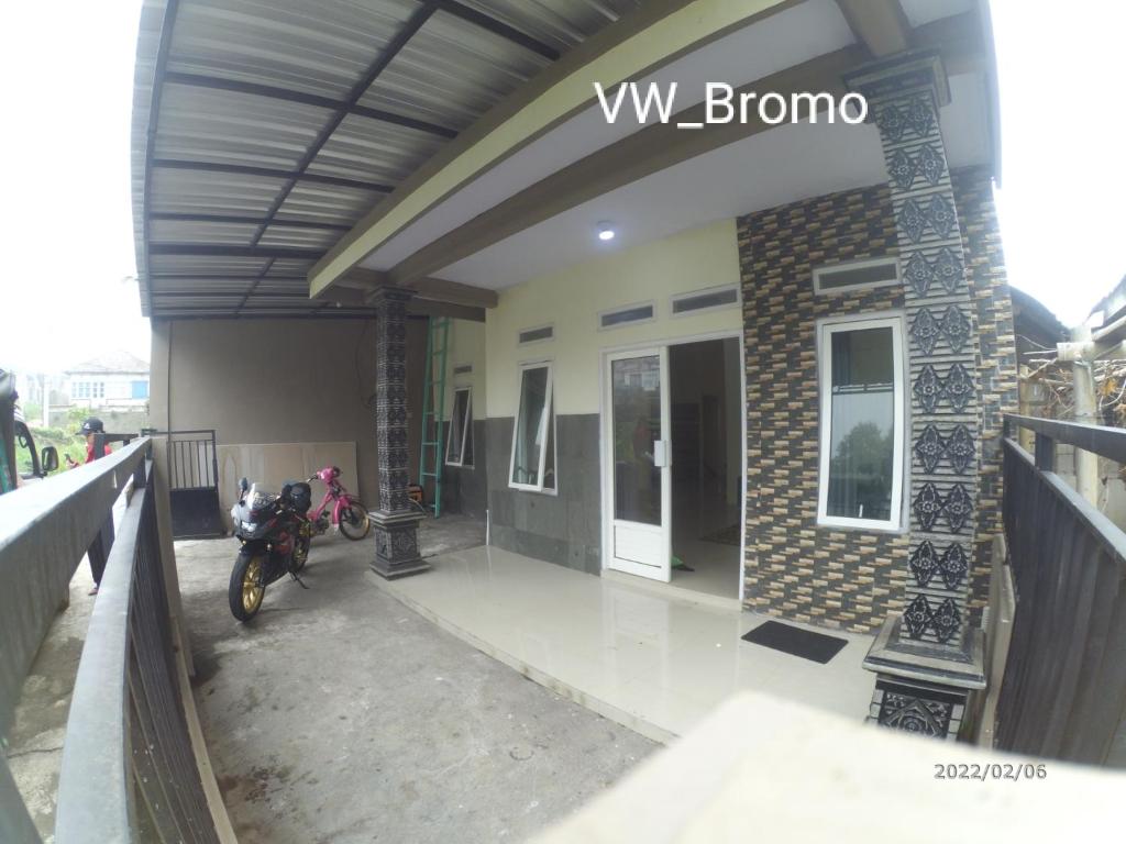a building with a motorcycle parked outside of it at wijayanti's villa in Probolinggo